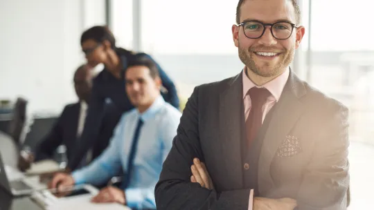 Confident business executive with folded arms