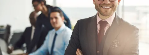Confident business executive with folded arms