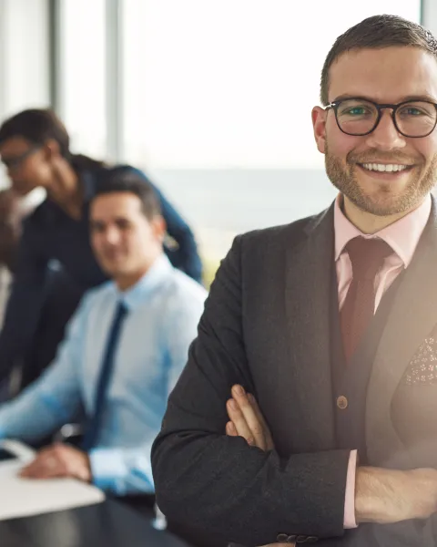 Confident business executive with folded arms